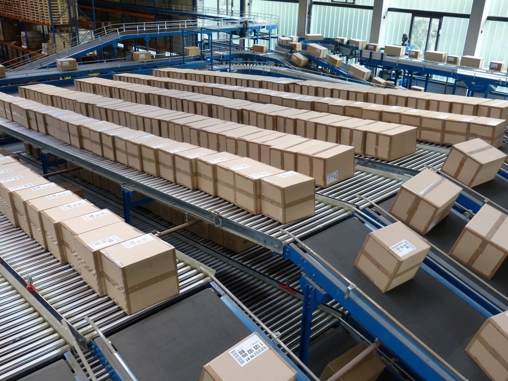 Parcels moving along a warehouse conveyor